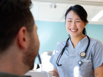 Physician talking with patient at a UPCC