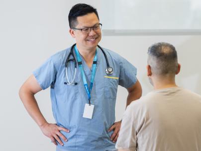 A physician meeting with a patient in a UPCC